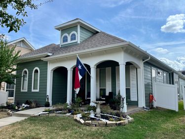 A painted house flying the Texas flag.